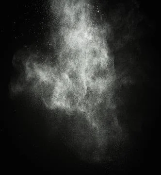 White powder exploding isolated on black Stockfoto's