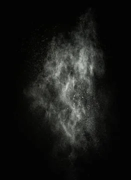 White powder exploding isolated on black 写真素材
