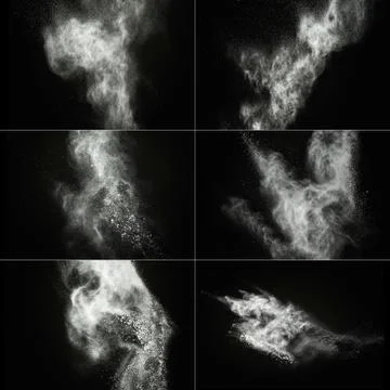 White powder exploding isolated on black Stock Photos