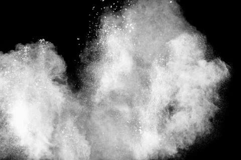 White powder explosion on black background Stock Photos