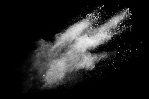 White powder explosion cloud against black background.White dust particle Stock Photos