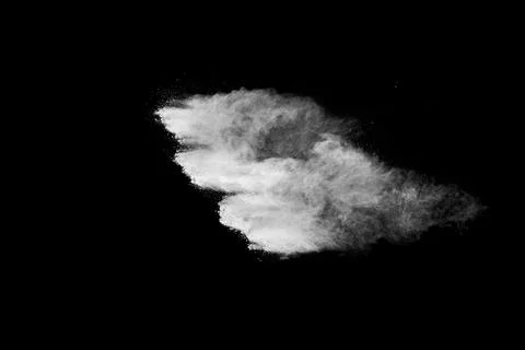 White powder explosion cloud against black background. White dust particles. Foto stock
