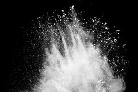 White powder explosion clouds.Freeze motion of white dust particles splash. Stock Photos