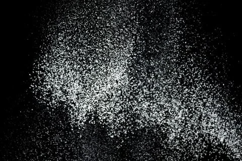 White powder explosion. White powder splash isolated on black background. F.. Stock Photos