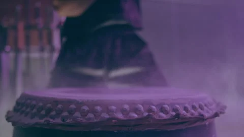 White powder rising while a man is hitting the drum Stock Footage 279825270