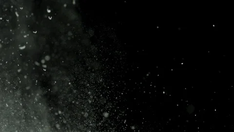 White powder with small particles exploding isolated on black background. Stock Stock Footage 106502421