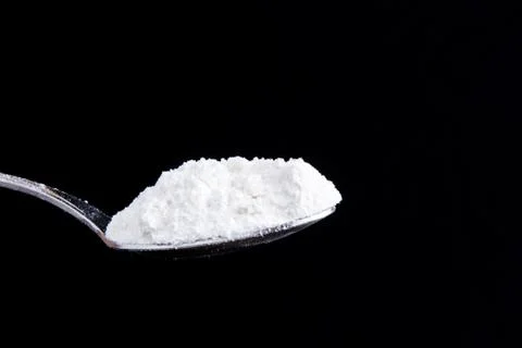 White powder on a spoon Foto stock