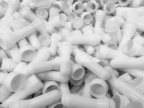 White preform for making plastic bottles for milk, water, and other PET liq.. Stock Photos