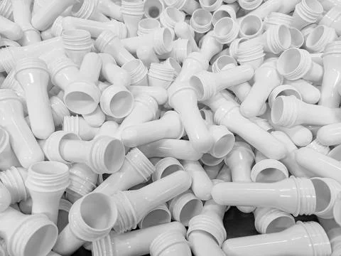 White preform for making plastic bottles for milk, water, and other PET liq.. Foto stock