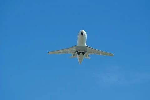 White Private Jet Climbing in Blue Sky After Takeoff Stock Photos