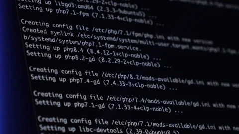 White programming code and detailed system setup messages on a dark monitor.. Stock Footage 320174421