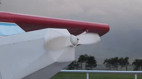 White propeller spinning on red and white light aircraft Stock-Footage 307865590