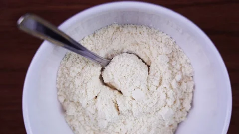 White protein powder in the dish with spoon Video stock 138363390