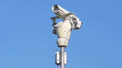 White public camera rotating on background blue clear sky. 스톡 동영상 251856009