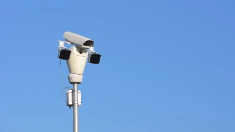 White public camera rotating on background blue clear sky. 스톡 동영상 251856072