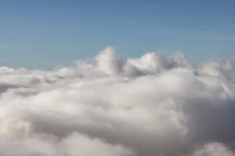 White Puff Clouds during a sunny day. Stock Photos