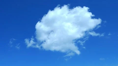 White puffy cloud against a blue sky Video stock 288310413