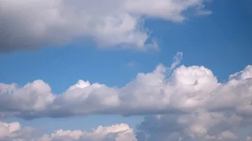 White puffy clouds on the blue sky background. Stock Footage 86115029