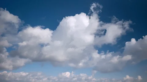White puffy clouds on the blue sky background. Stock Footage 86115508