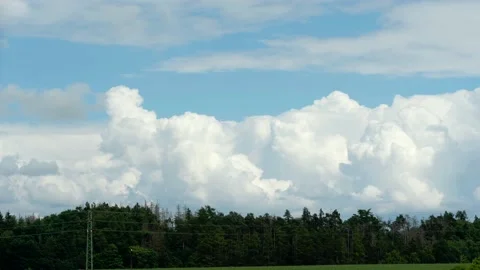 White puffy clouds on the blue sky background. Stock Footage 169231374