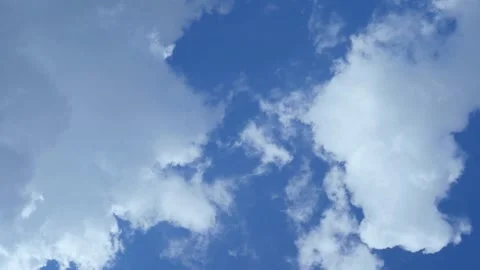 White Puffy Clouds in A Blue Sunny Sky Covers Sky With а Gray Rain Cloud Time La Stock Footage 236577705