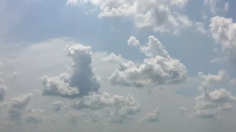 White Puffy Clouds Moving Forward 002 Stock Footage 93805395