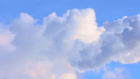 White puffy fluffy clouds floating in the blue sky on a sunny day Stock Footage 271180450