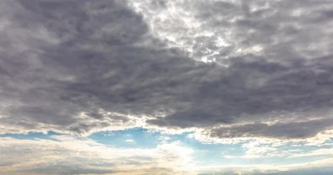 White puffy, fluffy, cumulus clouds rolling, flying, passing, fast moving blu Stock Footage 101450639
