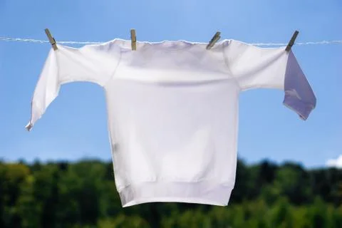 White pullover mock-up hanging on summer background 写真素材