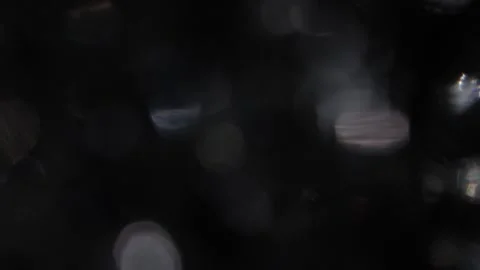 White pulsating bokeh on a full-screen black background Video stock 318065761