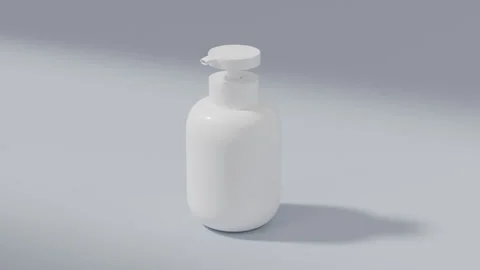 White pump bottle on clean background, dramatic rotating light Stock Footage 335081323