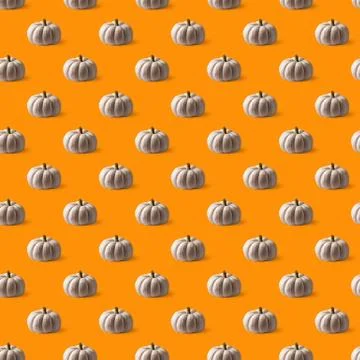 White pumpkin seamless pattern on orange background Stock Photos