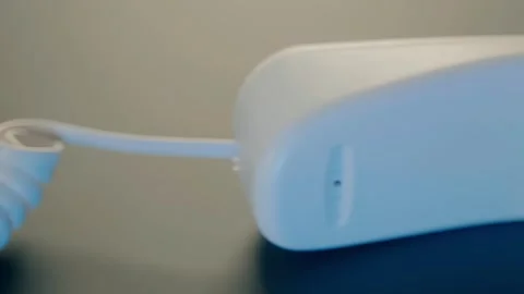 White push-button old telephone with the receiver removed and lying nearby Stock Footage 287958748