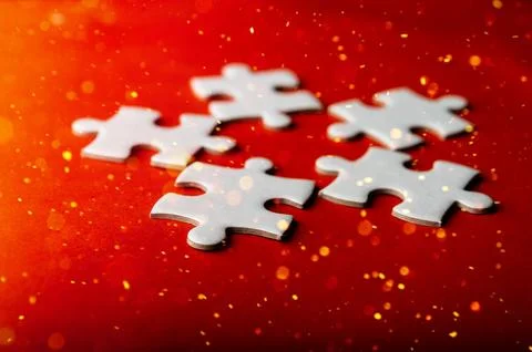White puzzles placed on an orange background Represent the unity and power .. 스톡 사진