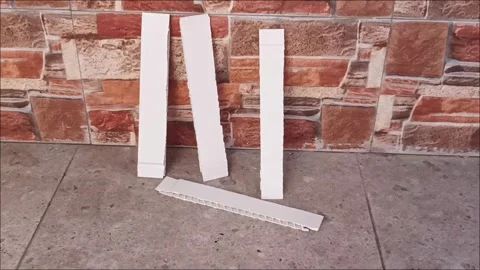 White PVC Plastic Corrugated Strip Profiles for Construction Video stock 333428635