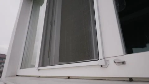White Pvc Window Frame with Installed Mosquito Net for Insect Protection Stock Footage 334735900