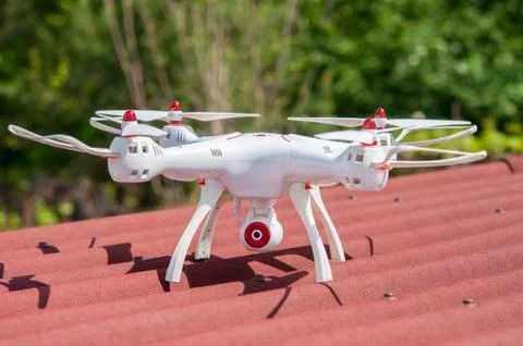 White quadcopter. Stock Photos