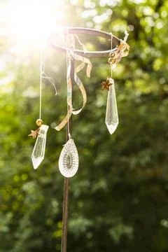 White quartz crystals hanging on strings over nature background Stock Photos