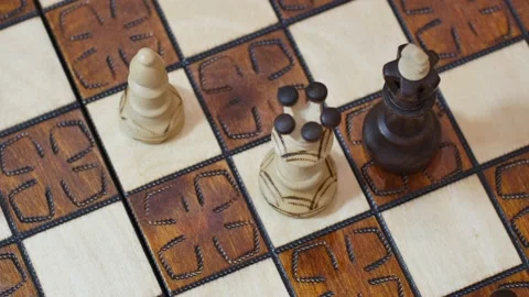 White queen checkmating, black king resigning. Chess business concept, leader or Stock Footage 146227633