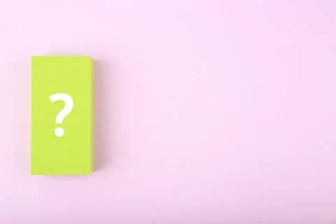 White question mark on green rectangle against colored bright purple background Stock Photos