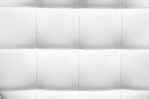 White quilted leather texture background with stitched seams, elegant upholst Stock Photos