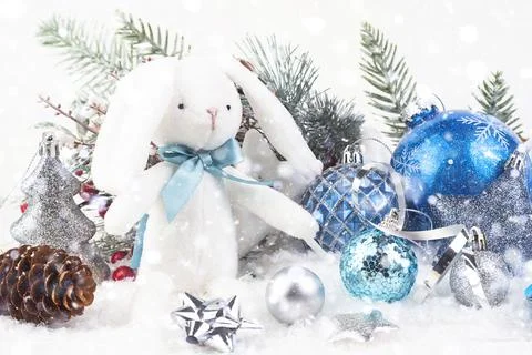 White rabbit with a blue bow Stock Photos