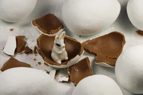 White Rabbit In Chocolate Candy Easter Eggshells Stock Photos