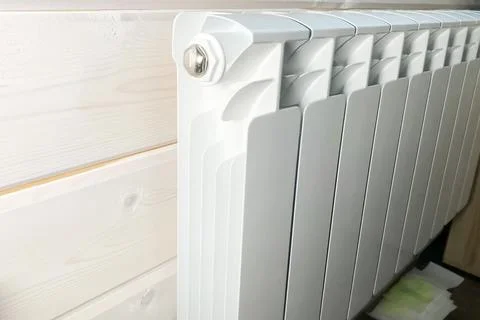 White radiators of heating system. New building house, heating installation Stock Photos