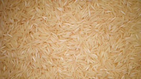 White raw organic basmati rice rotation background. Food ingredient background Stock Footage 122171933