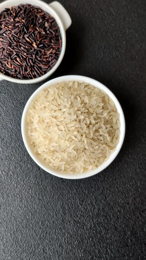 White raw rice in a ceramic bowl. Rice as an ingredient Stock Footage 305492331