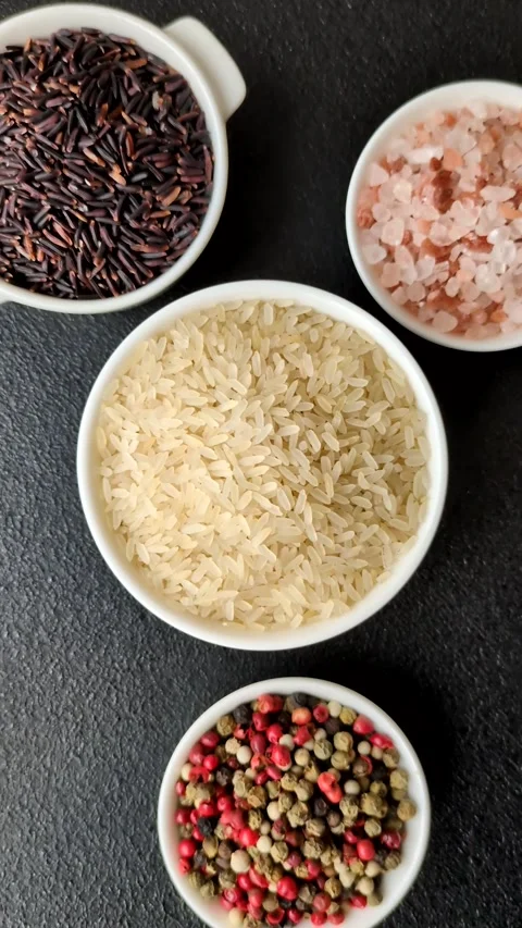 White raw rice in a ceramic bowl. Rice as an ingredient Stock Footage 305492334