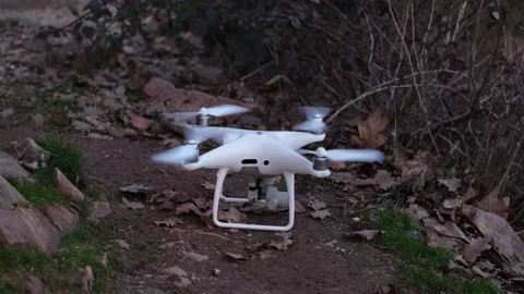 White RC quadcopter with digital camera taking off Stock Footage 149287165