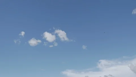 White, real, nice, soft clouds &amp; clear blue sky Stock Footage 106688407