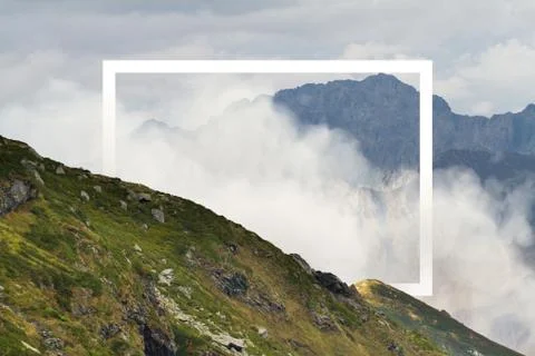 White rectangle in the middle of cloudy mountain landscape. Natural and unkown. 스톡 일러스트